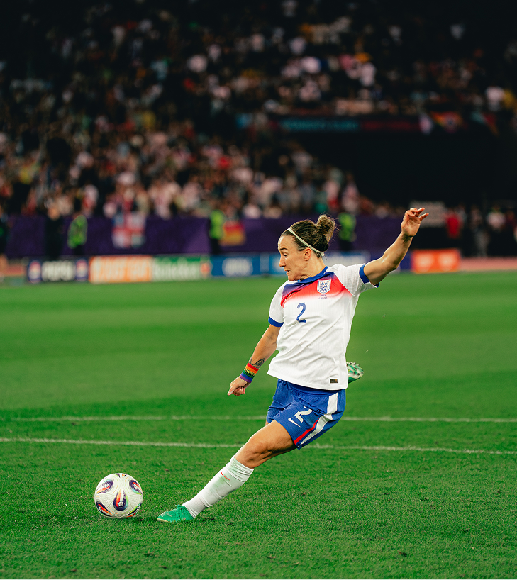 Lucy Bronze striking the ball